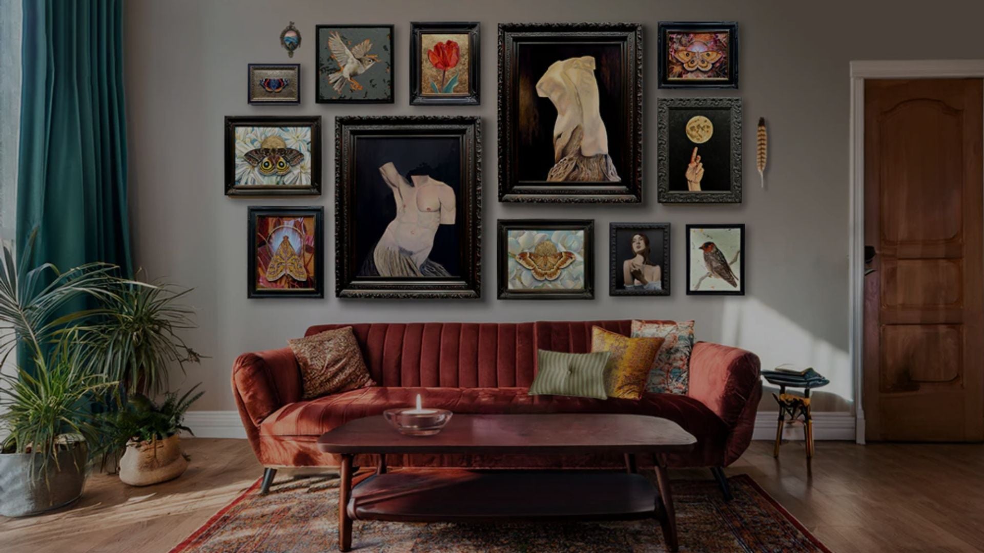 Living room with a red sofa, coffee table, and wall art